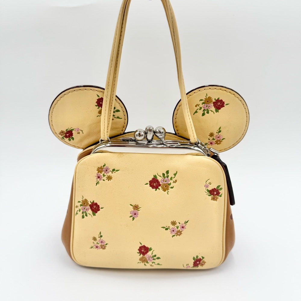 Coach Limited Edition Disney X Coach
Floral Minnie Mouse Ear Kisslock Bag